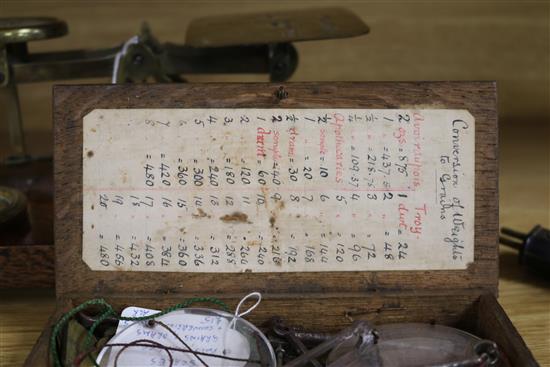 A set of postal scales and a set of apothecary scales